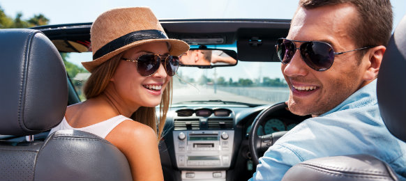 A happy couple enjoying the roadtrip