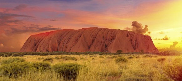 colourful clouds in ayers rock at sunset